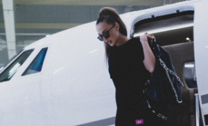 Woman exiting airplane